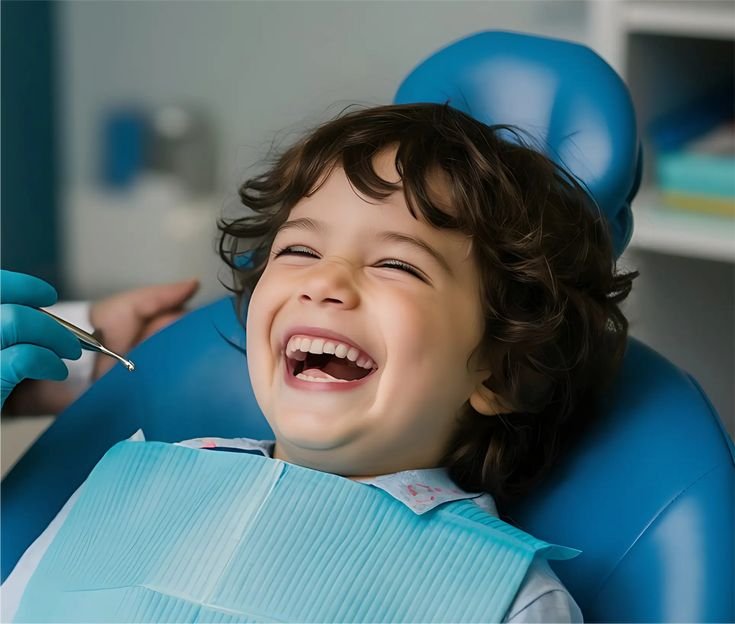 Smiling child during a gentle dental checkup with a pediatric dentist